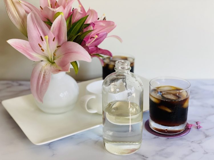 Ice coffee, simple syrup, and flowers