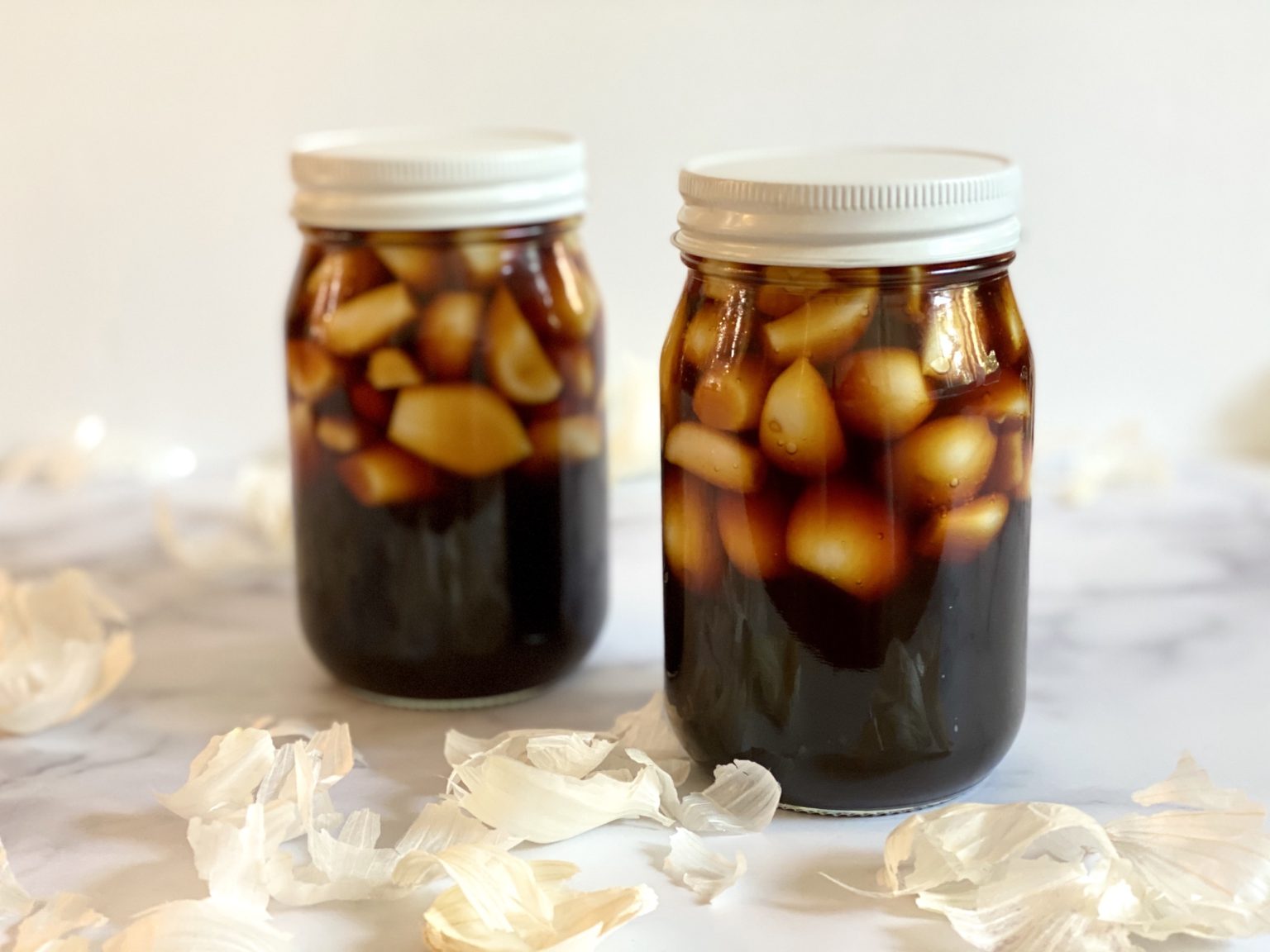 Canning Recipes Post: Garlic pickled in a jar with soy sauce.