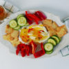 A Plate of Hot Pepper Jelly with Cucumbers, Cream Cheese, Red Peppers, and Crackers. Learn how to make our hot pepper jelly recipe