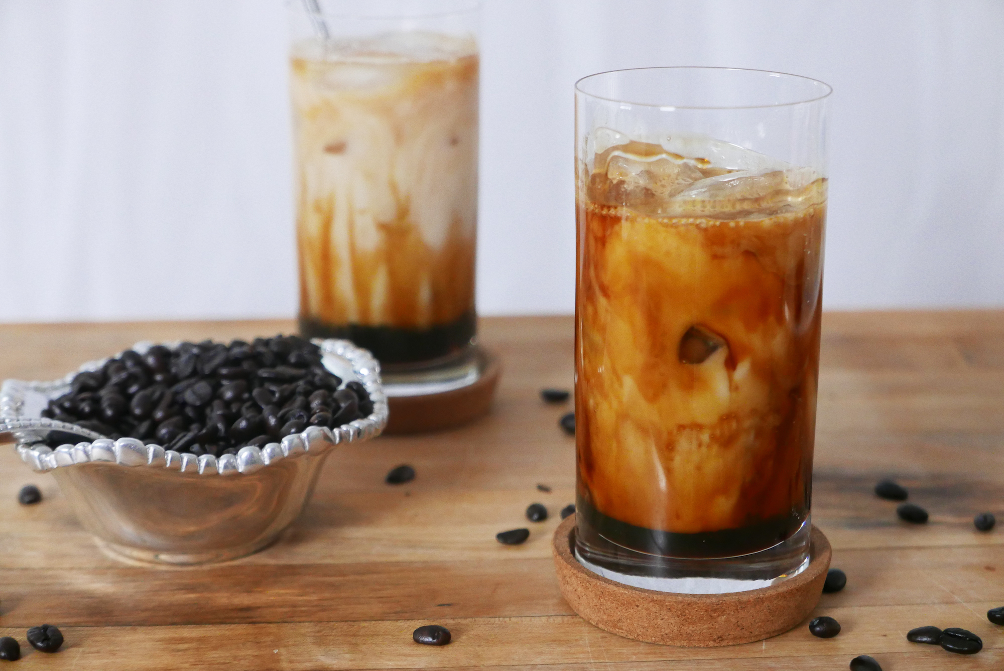 Korean drink for cafes: two iced glasses of burnt brown sugar latte