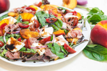 A plate of summer peach Caprese salad
