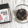 An overhead shot of chunjang and a container of the paste