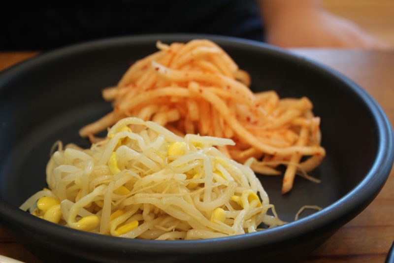 Mung bean sprout salad next to radish salad