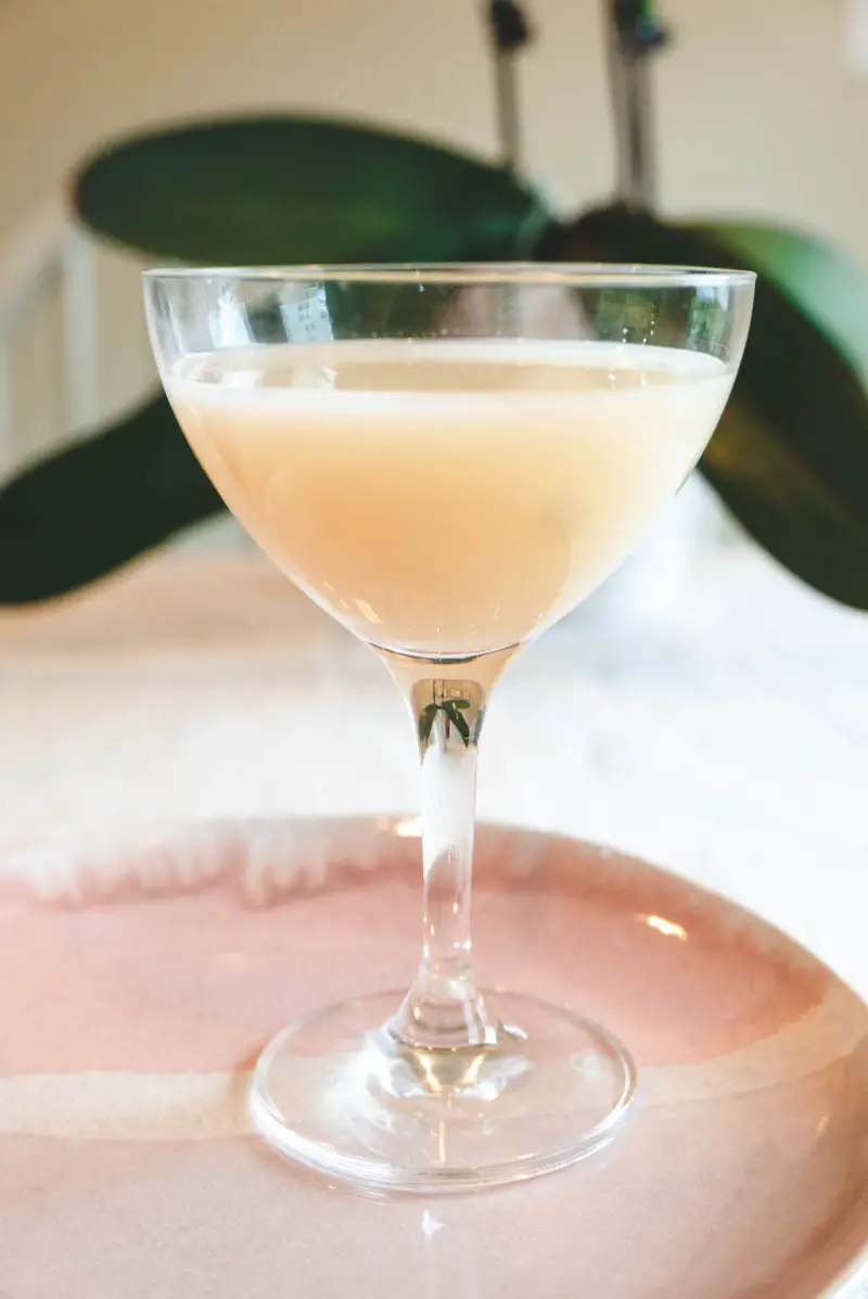 A side shot of Yakult soju in a martini glass. 