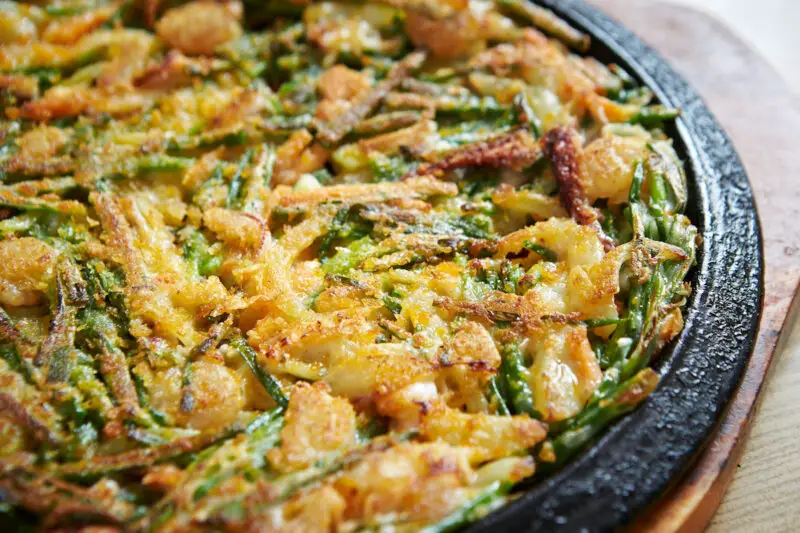 A closeup shot of Korean buchujeon, otherwise known as Korean garlic chive savory pancakes.