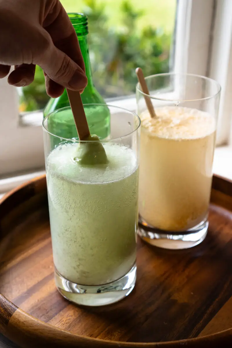 A side shot of these cocktails. In this photo, I am stirring the ice cream bar into the drink. 